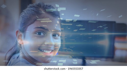 Composition of tunnel with colourful rectangles over smiling schoolgirl using computer. global technology, data processing and digital interface concept digitally generated image.
