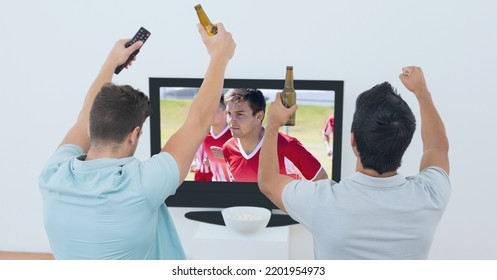 Composition Of Two Male Sports Fans Watching Football Match On Tv. Sport And Competition Concept Digitally Generated Image.