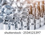 Composition with a variety of metal tools.Sockets, tools,spanners and bits.Mixed screws and nails. Industrial background.Close-up of various screws. Use for background, 