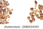 Composition of Walnuts kernels and shells of walnuts with free space for your text. Background of Walnuts. Walnuts Scattered on white background.