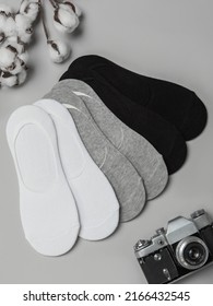 Composition Of Women's Socks On Gray Background. Flat Layout, Table Layout. Top View. Comfortable Footwear For Ladies And Girls. Cozy Women's Hosiery.