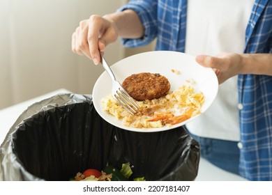 Compost From Leftover Food, Refuse Asian Young Housekeeper Woman, Girl Hand Using Fork Scraping Waste From Dish, Throwing Away Putting Into Garbage, Trash Or Bin.
Environmentally Responsible, Ecology.