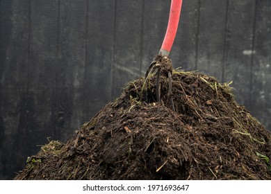 Compost Pile With Fork In It