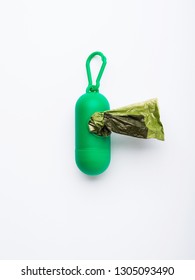 Compostable dog poop bags dispenser on white background. Eco friendly solution for pet owners
