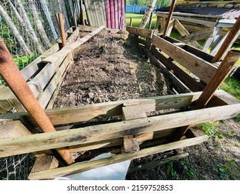 Composted Soil In Wooden Compost Bin.