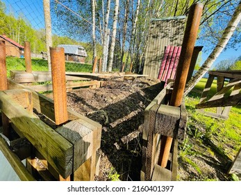 Composted Soil In Wooden Compost Bin.