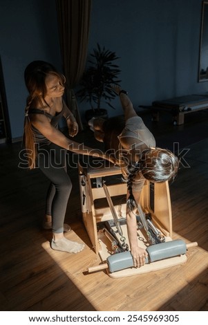 Comprehensive Pilates training session that includes essential posture correction. Exercises to improve mobility on a Pilates chair