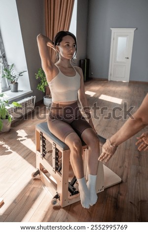 Comprehensive Pilates training session that includes essential posture correction. Exercises to improve mobility on a Pilates chair