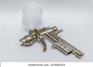 Compressed Air Paint Gun Isolated On White Background.