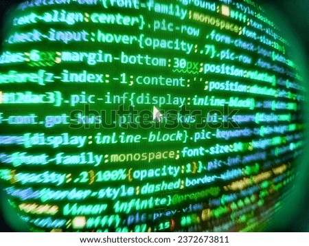 Compressed javascript code on computer screen. Gibberish dummy lorem ipsum text. Web development javascript HTML5 code. Closeup of Java Script and HTML code