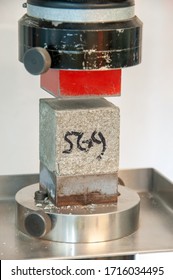 Compressive Strength Over A Cube Of Concrete In A Cement Factory Lab