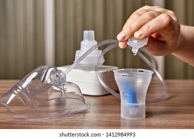 Compressor Nebuliser System And Nebulization Tube On The Table, Where Medicine For Patients With Chronic Obstructive Pulmonary Disease Preparing.