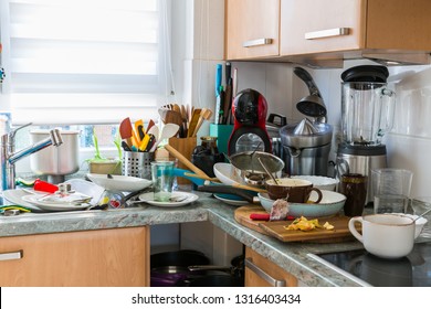 Compulsive Hoarding Syndrom - messy kitchen with pile of dirty dishes - Shutterstock ID 1316403434