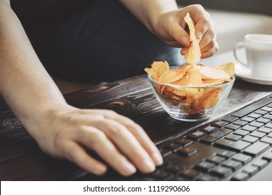 Compulsive Overeating, Mindless Snacking, Junk Food, Unhealthy Meals. Woman Eating Chips From Bowl At Her Workplace