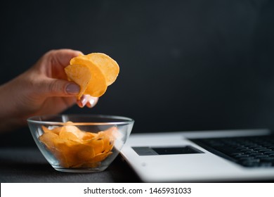 Compulsive Overeating, Mindless Snacking, Junk Food, Unhealthy Meals. Woman Eating Chips From Bowl At Her Workplace