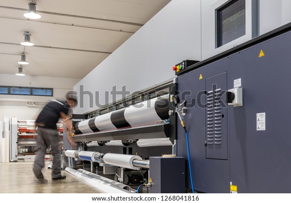 Computer aided\
printing process, advanced technology in the press and publishing\
sector, latest generation robotized plotting machines for mass\
production and big format\
prints.
