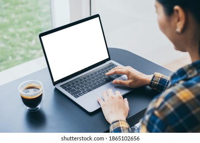computer blank screen mockup.hand woman work using laptop with white background for advertising,contact business search information on desk at coffee shop.marketing and creative design - Shutterstock ID 1865102656
