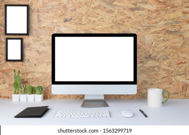 Computer with blank white copy space for text, Mockup design desktop computer in office on white table with keyboard and Coffee cub, Work place concept, Cactus in pot. - Shutterstock ID 1563299719