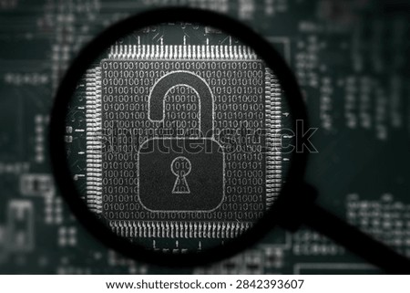 Computer board with chip. View through magnifying glass. Hackers launch cyber attacks. Hackers violate privacy. Hacker is searching  personal data.
