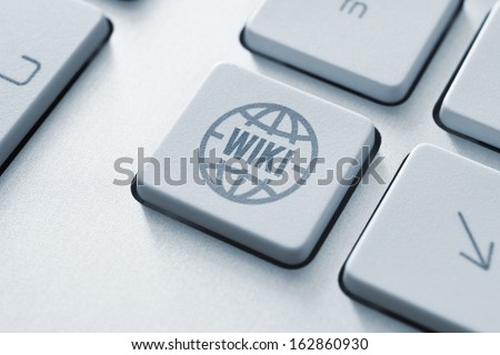 Computer button on a keyboard with online wiki encyclopedia icon symbol