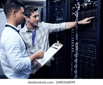 Computer center, men and data engineer with checklist, hardware and connection as programmer in it. Male people, inspection and technician for security, system update or maintenance in server room - Powered by Shutterstock