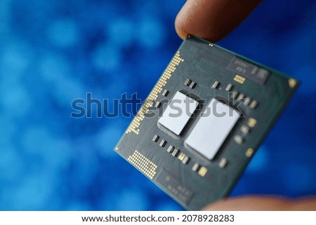 Computer chip in hands. A chipset is a set of electronic component that is integrated and flows data between the processor. Chipsets usually work with a specific family of microprocessors.