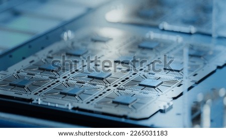 Computer Chip Manufacturing at Fab. Close-up of Silicon Dies From Semiconductor Wafer are Attached to Substrate. Semiconductor Packaging Process.