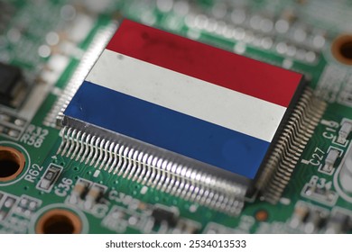 Computer chip on PCB board with Netherlands flag. CPU Central processing Unit or GPU microchip on a motherboard - Powered by Shutterstock - Get 15% off with code: PIKWIZARD15