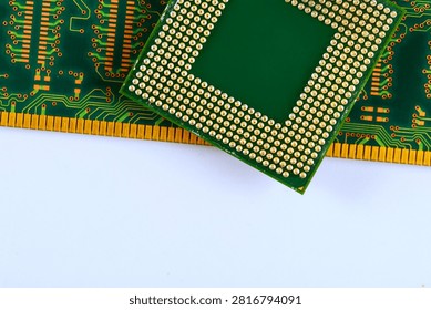 Computer chip is placed on green RAM circuit board many tracks gold pins along edges.