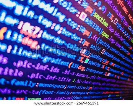 Computer code background. Colorful programming source typed on the screen of the monitor with shallow focus effect. Modern technology and futuristic concept abstract visualization of software. 