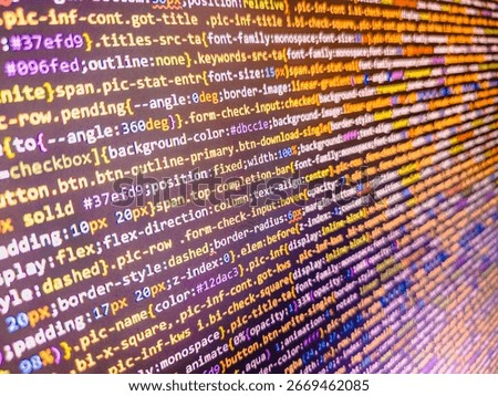 Computer code background. Colorful programming source typed on the screen of the monitor with shallow focus effect. Modern technology and futuristic concept abstract visualization of software. 