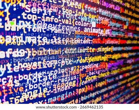 Computer code background. Colorful programming source typed on the screen of the monitor with shallow focus effect. Modern technology and futuristic concept abstract visualization of software. 