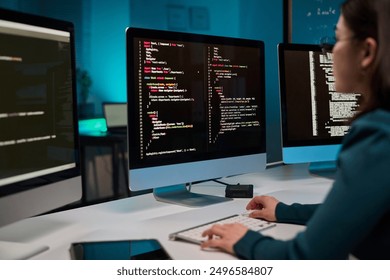 Computer with code lines on screen and unrecognizable young woman typing IT and cybersecurity concept copy space