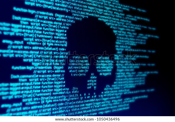 Computer code on a screen with a skull\
representing a computer virus / malware\
attack.