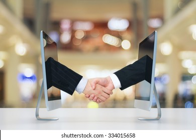 Computer communication concept with human handshake