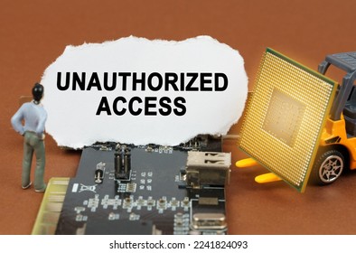 Computer concept. On the board with microcircuits lies a paper plate with the inscription - Unauthorized Access. Nearby is a toy loader with a processor and a human figurine. - Shutterstock ID 2241824093
