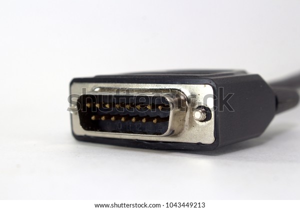 Computer connector of a scanner for car\
diagnostics on a white background\
close-up