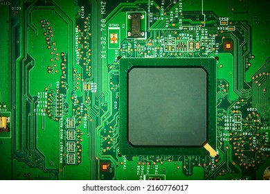 Computer cpu processor chip on circuit board with motherboard background. Close-up. - Powered by Shutterstock - Get 15% off with code: PIKWIZARD15