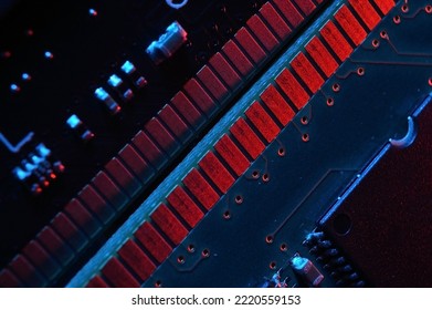 Computer cpu processor chip on circuit board ,motherboard background. Close-up. With red-blue lighting