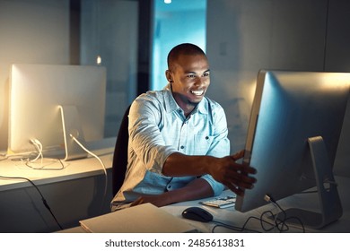Computer, creative and web design with developer man in office at night for programming or research. Desktop, development and smile with happy programmer person in workplace for online reading
