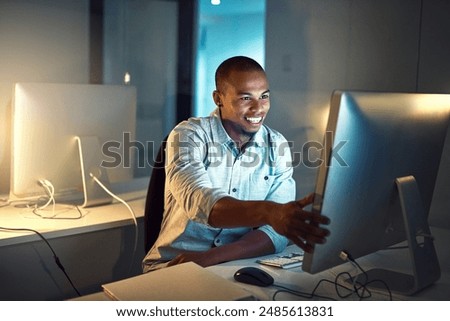 Computer, creative and web design with developer man in office at night for programming or research. Desktop, development and smile with happy programmer person in workplace for online reading