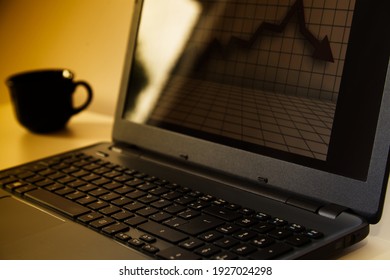 A computer and a cup of coffee