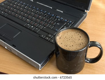Computer and cup of coffee
