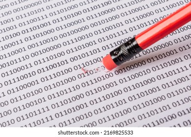 Computer data by 0 and 1 on white paper. Part of the data is deleted