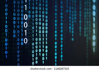 computer data matrix. vertical digital binary code moving motion downward. light up blue one and zero text flowing down. black background space with multiple layers coding.