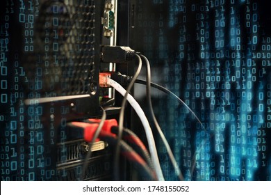 computer data transfer into desktop pc by internet LAN line. double exposure shot of backside of a computer and red binary codes. hacker virus spyware ransomware and security breached concepts.