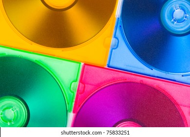 Computer disks in multiciolored boxes - technology background