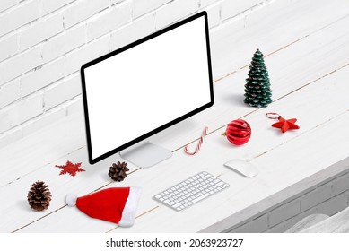 Computer Display Mockup On Work Desk Surrounded By Christmas Decorations. Isometric View