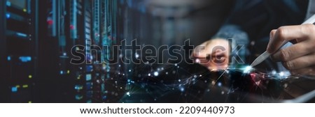 Computer engineer using digital tablet with server room, data center, big data storage as backgrounds, digital technology, database, IT support, internet network technology