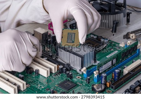 Computer Engineer Working With Processor And Motherboard In Technical Service Laboratory